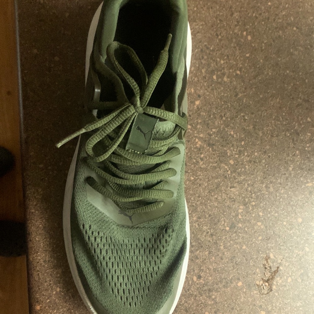 A green puma athletic shoe